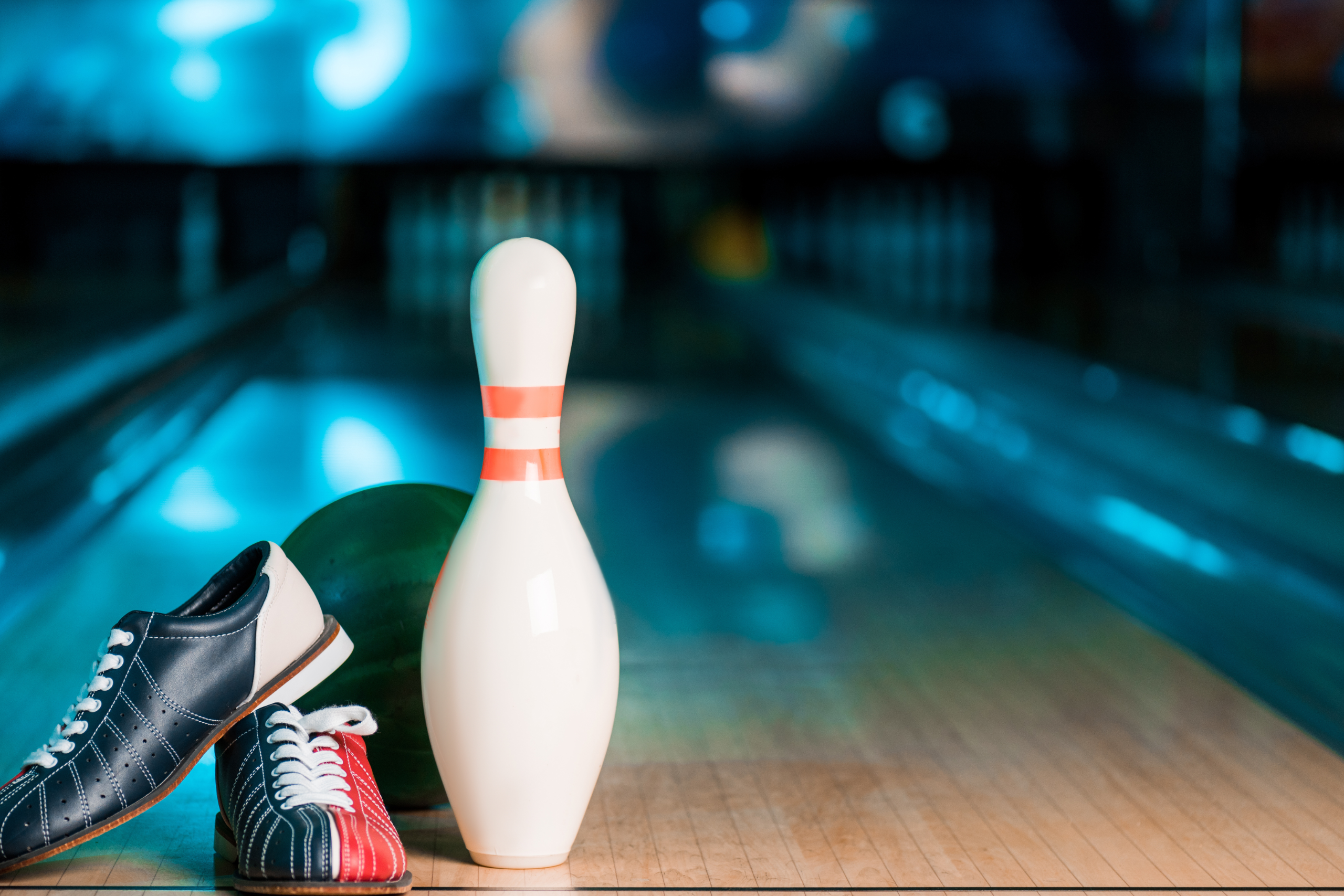 Image of bowling shoes and a bowling pin