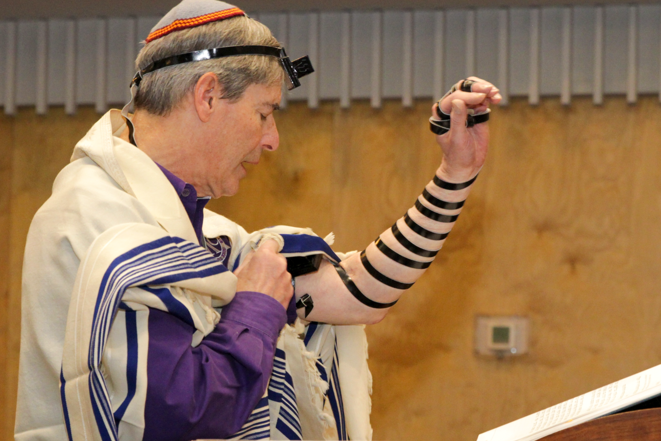 An image of a prayer leader at morning minyan service